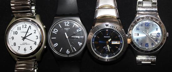 Two Swatch watches, an atomic talking watch and a Pulsar kinetic watch.